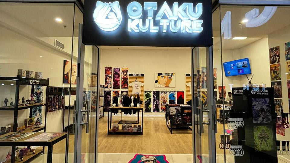 Storefront of 'Otaku Kulture' with glass doors and interior display.